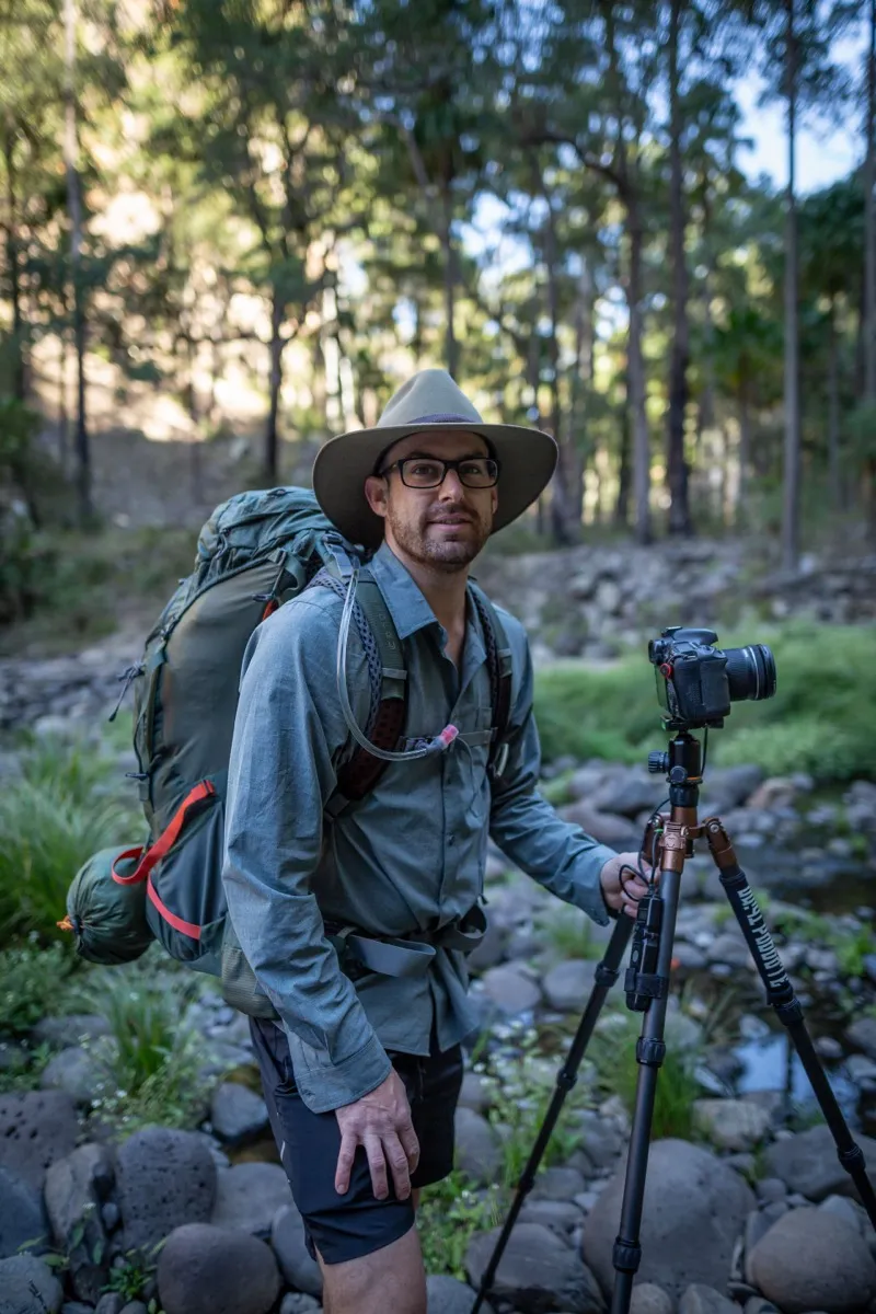 Nick Royal hiking with camera in hand, Australia