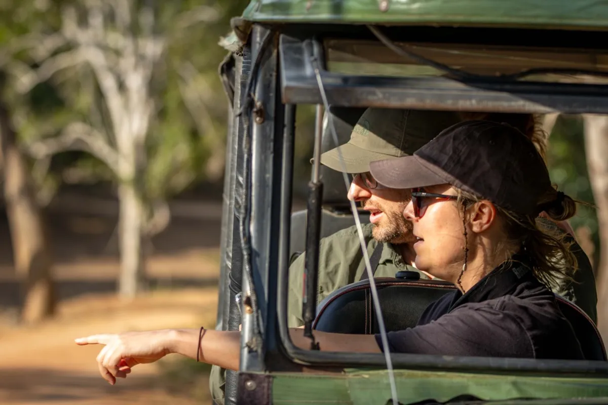 Travellers watching wildlife from a safari jeep, Kumana National Park, Sri Lanka